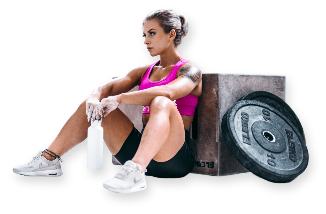 Coach Aspenskog is taking a break. She is holding a water bottle in her hands.